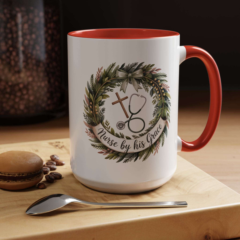 White mug with red interior and handle, featuring a design with a cross, stethoscope, and wreath, on a wooden surface with coffee beans and a macaron.