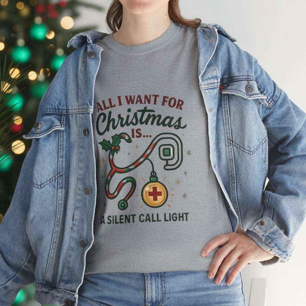 Person wearing a gray t-shirt with Christmas-themed design and denim jacket.